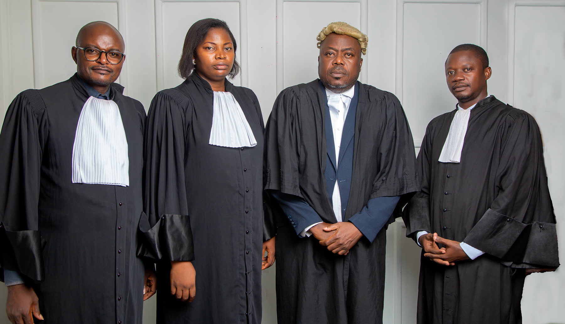 The lawyers of Fonju & Partners Law Firm in court robes, the principal in a barrister’s wig